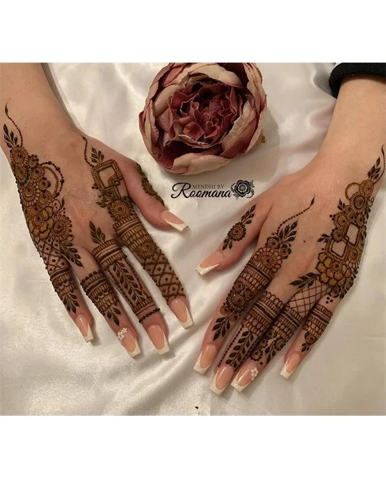 Flowing Spiral Harmony Blending Into Back Hand Mehndi Design